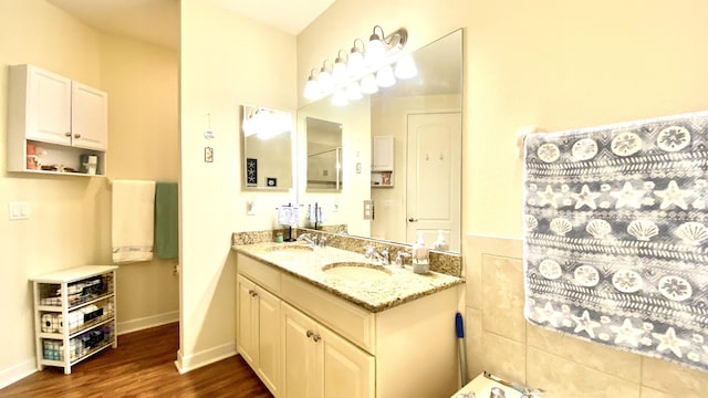 bathroom featuring separate shower and tub, hardwood / wood-style floors, and vanity