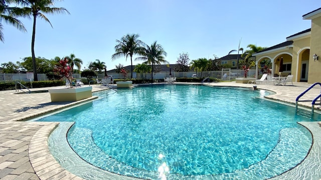 view of swimming pool with a patio area