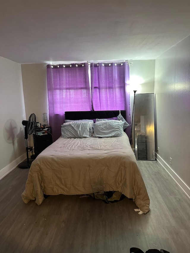 bedroom with hardwood / wood-style floors