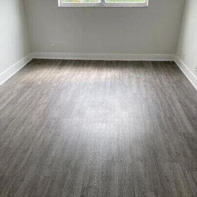 unfurnished room featuring dark hardwood / wood-style floors