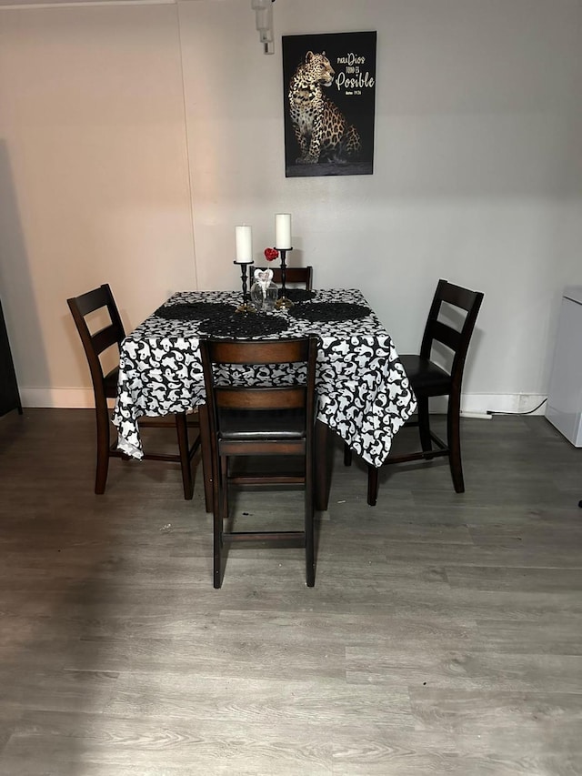 dining area with hardwood / wood-style flooring