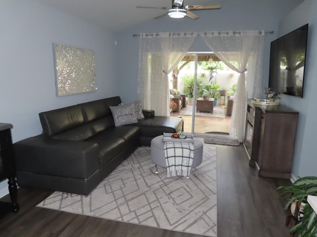 living room with vaulted ceiling, ceiling fan, and hardwood / wood-style flooring