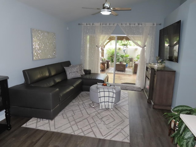 living room with wood-type flooring, lofted ceiling, and ceiling fan