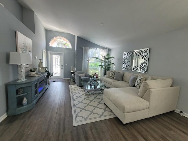 living room with lofted ceiling and dark wood-type flooring