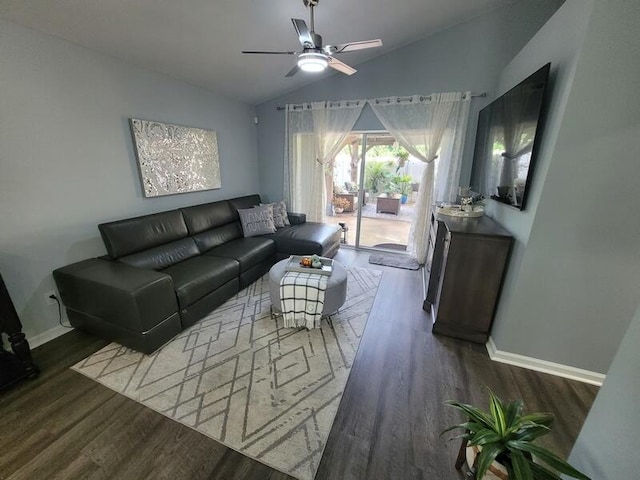 living room featuring ceiling fan, dark hardwood / wood-style floors, and vaulted ceiling