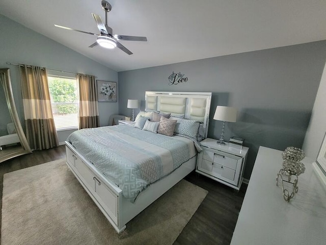 bedroom with ceiling fan, lofted ceiling, and dark hardwood / wood-style floors