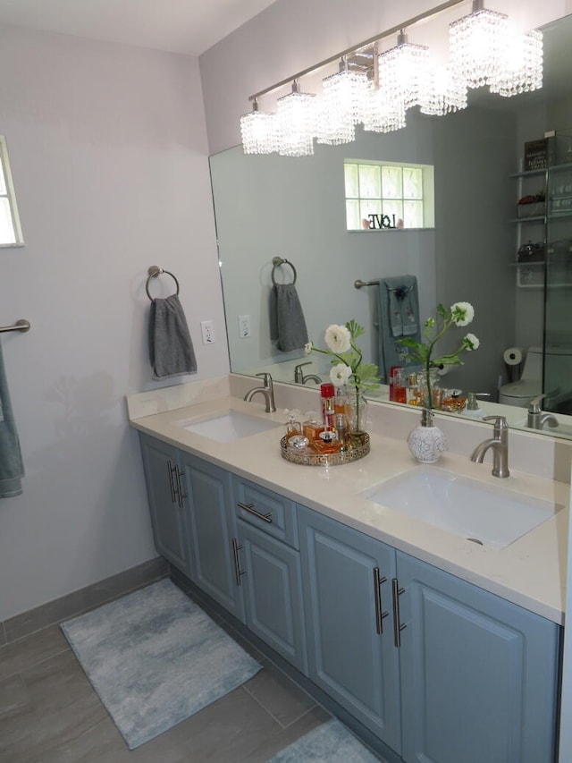 bathroom with vanity and toilet