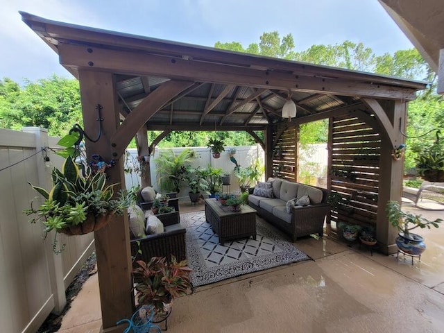 view of patio featuring an outdoor living space and a gazebo