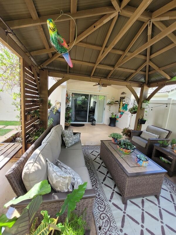 view of patio / terrace with outdoor lounge area and a gazebo