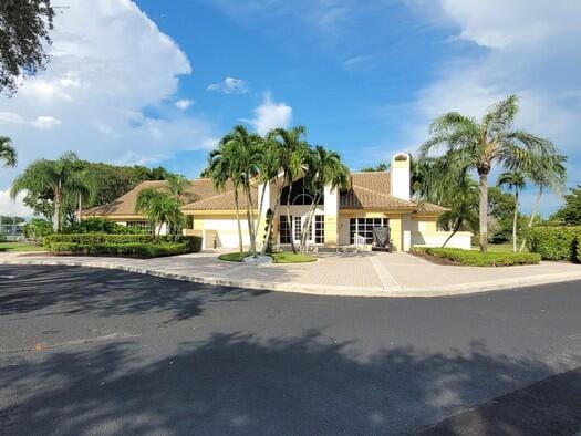 mediterranean / spanish house with a garage