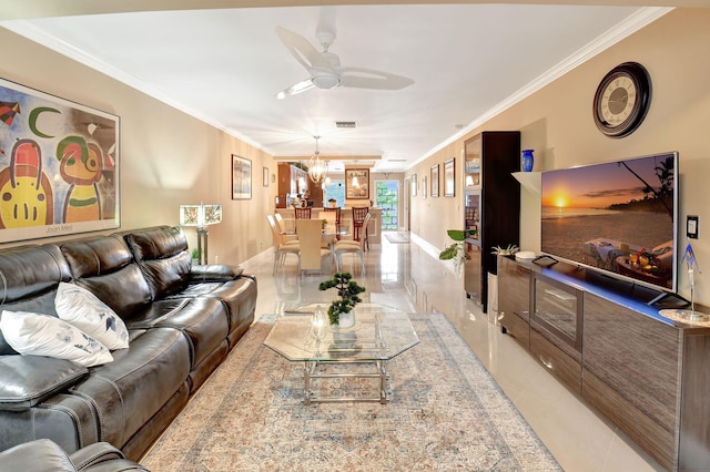 tiled living room featuring crown molding and ceiling fan with notable chandelier