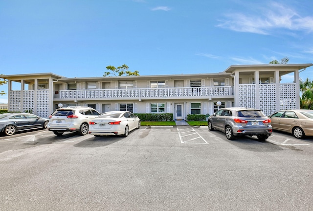2721 SW 15th St Unit 203, Delray Beach, FL 33445 - view of property featuring uncovered parking