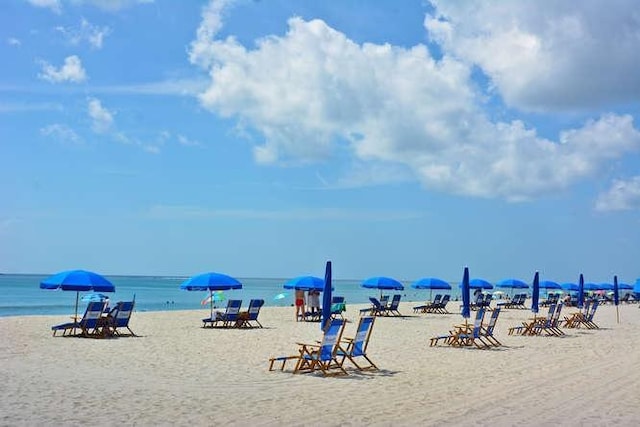 property view of water featuring a beach view