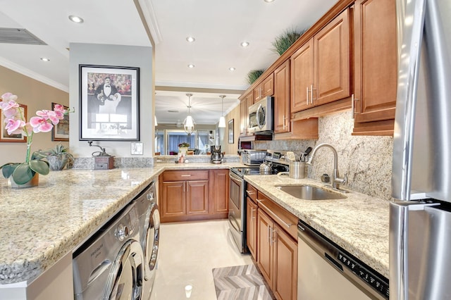 kitchen featuring sink, stainless steel appliances, backsplash, kitchen peninsula, and ornamental molding