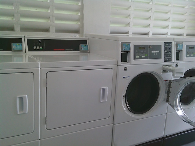 washroom featuring washer and clothes dryer