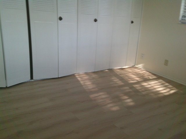 unfurnished bedroom with light hardwood / wood-style flooring