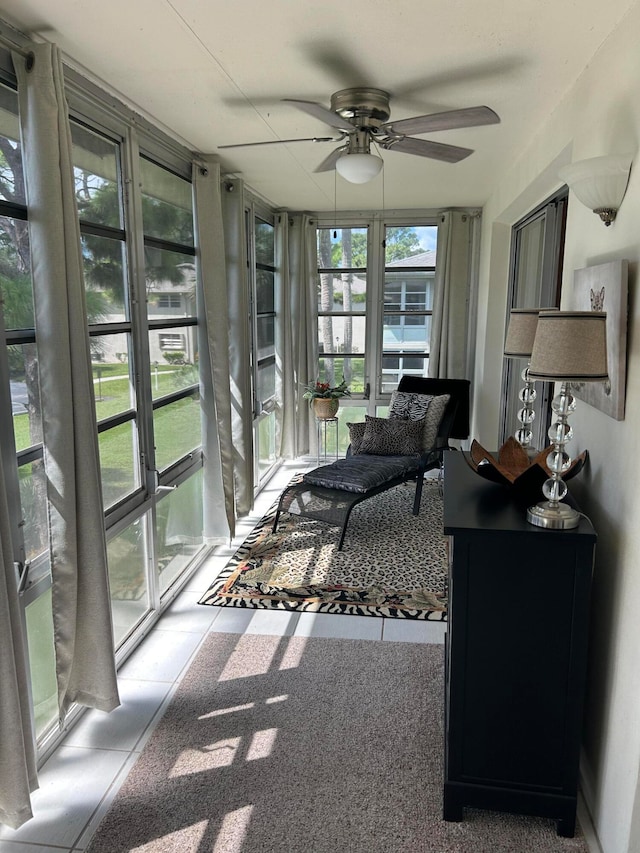 sunroom / solarium with ceiling fan