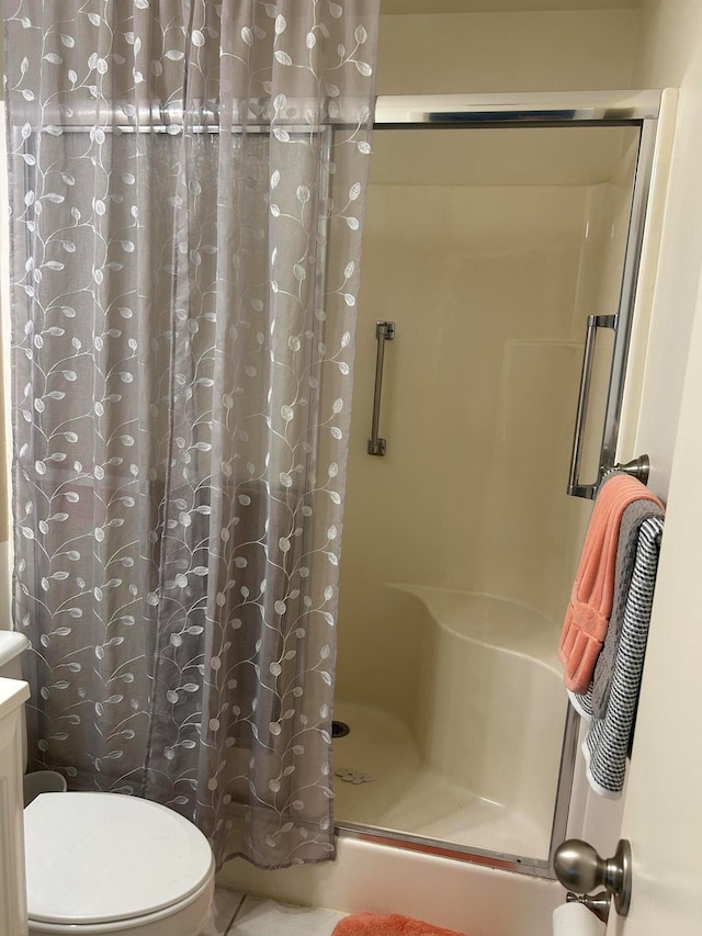 bathroom featuring vanity, toilet, and walk in shower