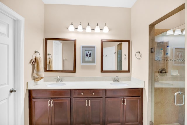 bathroom featuring walk in shower and vanity