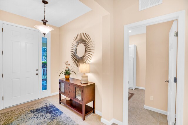 entryway featuring light tile patterned floors