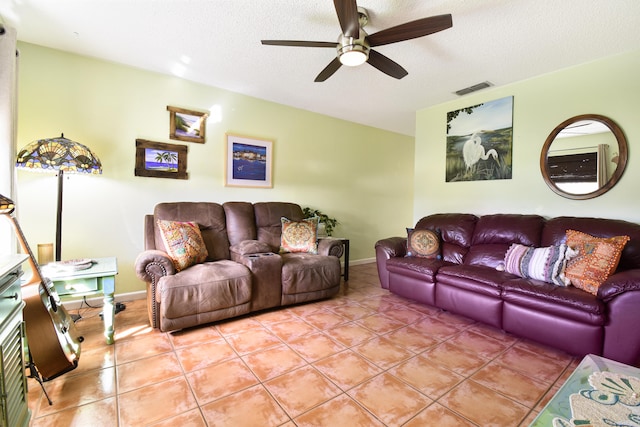 tiled living room featuring a textured ceiling and ceiling fan