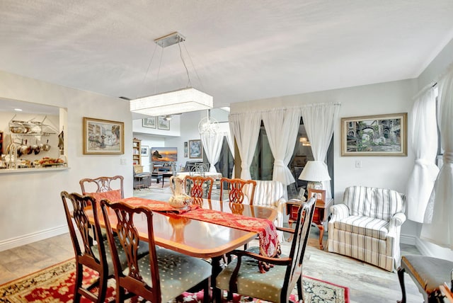 dining space featuring light hardwood / wood-style floors