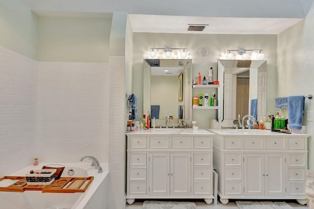 bathroom with a bath and vanity