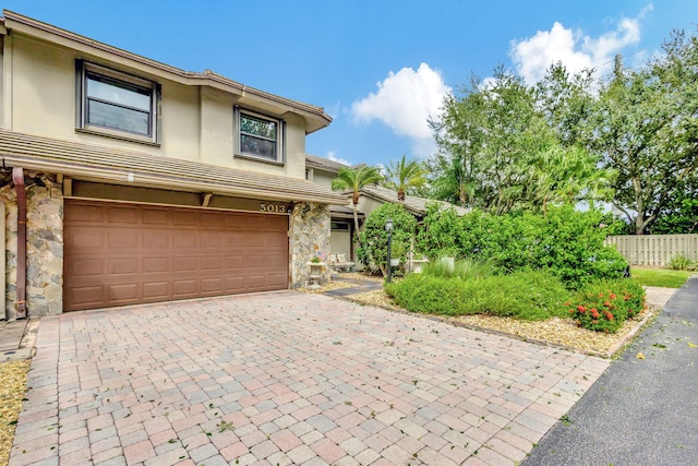 view of front of property featuring a garage