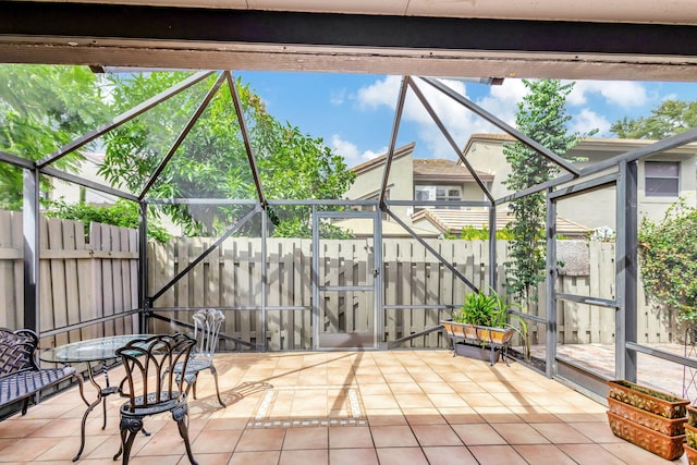 view of patio / terrace featuring a lanai