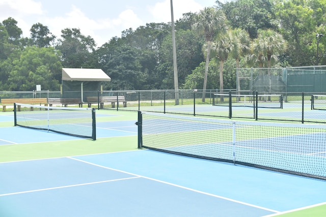 view of tennis court with fence