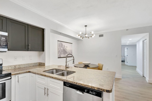 kitchen with stainless steel appliances, crown molding, sink, and white cabinetry