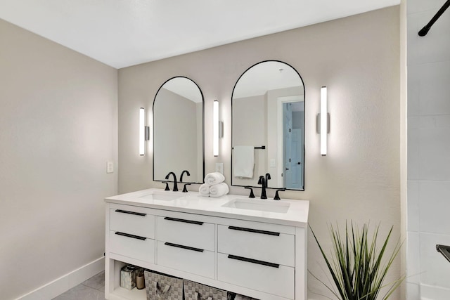 bathroom with tile patterned flooring and vanity