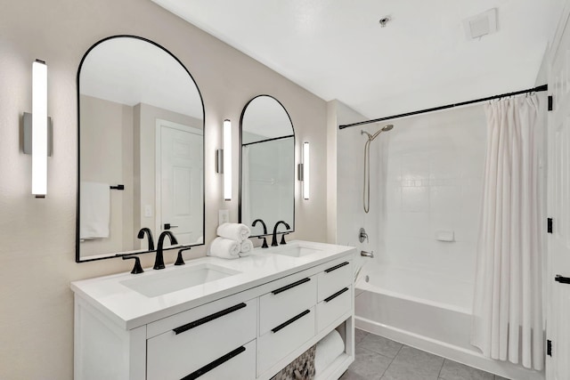 bathroom with shower / tub combo, vanity, and tile patterned floors