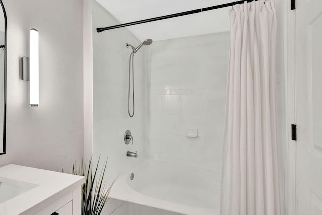 bathroom with shower / bathtub combination with curtain and vanity