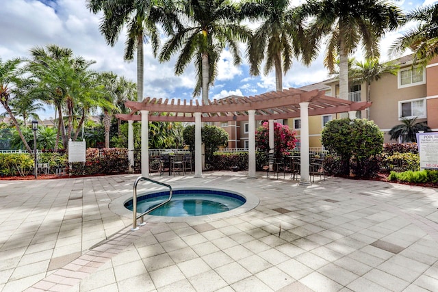 view of pool featuring a pergola, a community hot tub, and a patio area