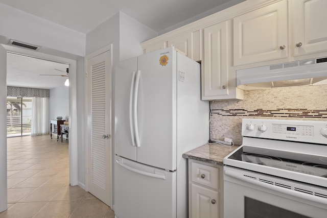 kitchen with white appliances, ceiling fan, backsplash, white cabinets, and light tile patterned flooring