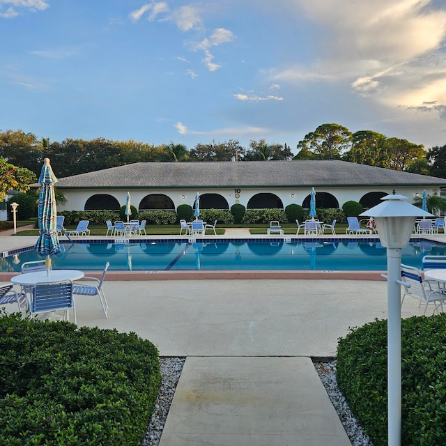 view of swimming pool with a patio area