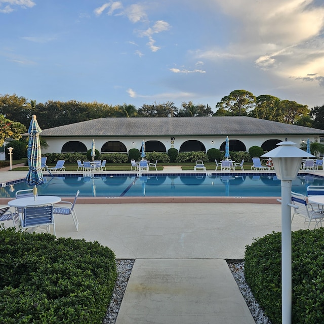 view of swimming pool featuring a patio area