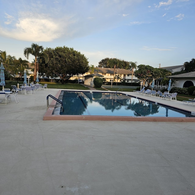 view of swimming pool with a patio area