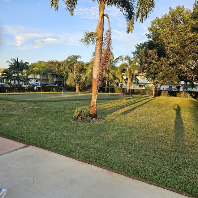 surrounding community featuring a lawn