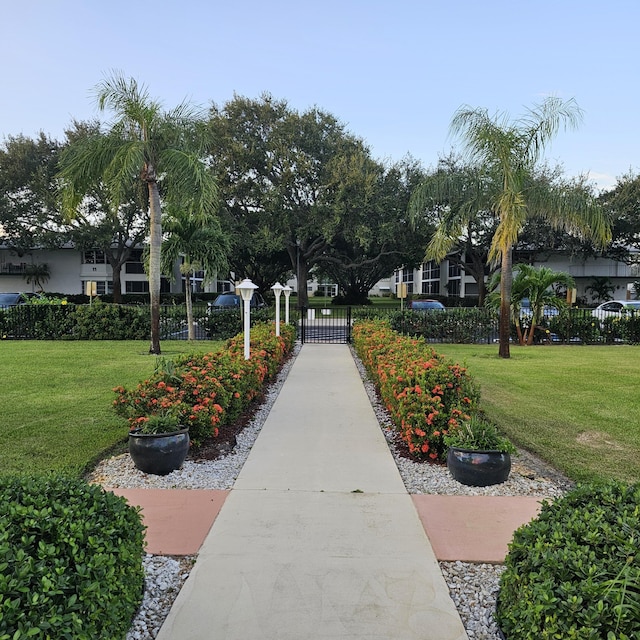 view of home's community featuring a lawn