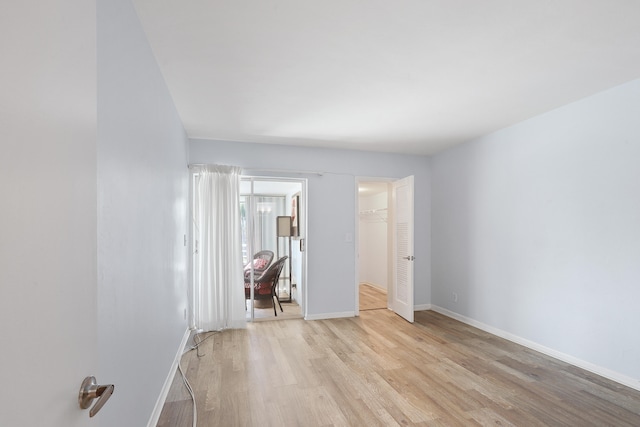 unfurnished room with light hardwood / wood-style flooring