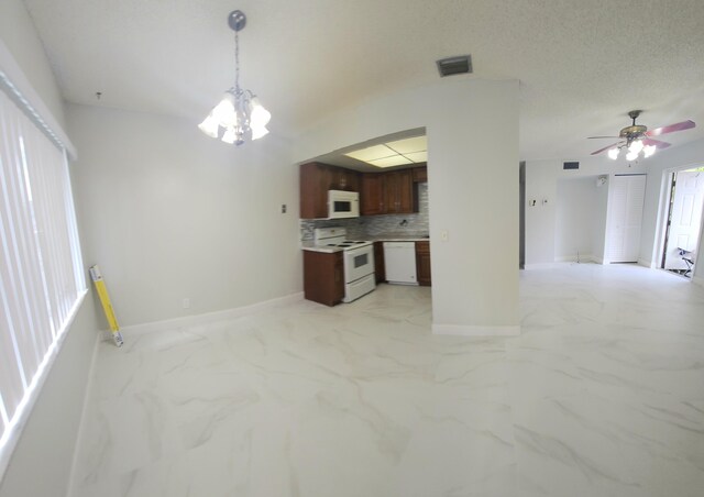 kitchen with extractor fan, sink, a drop ceiling, light tile patterned floors, and white appliances