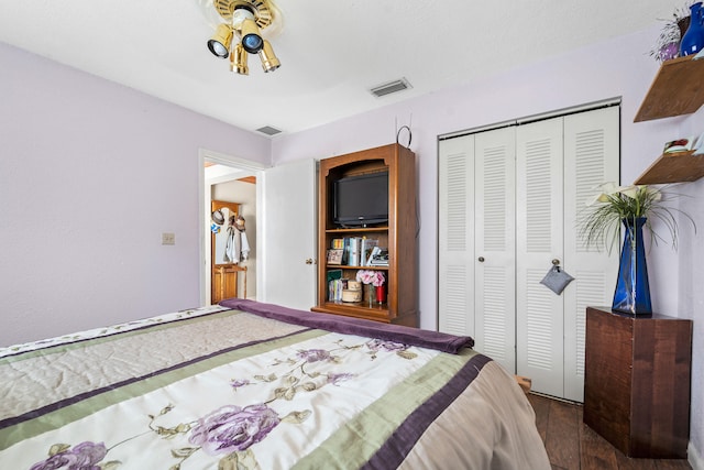 bedroom featuring a closet and hardwood / wood-style flooring