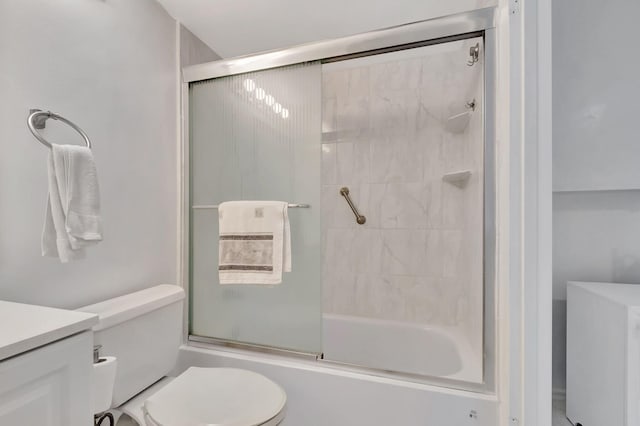 full bathroom featuring vanity, toilet, and bath / shower combo with glass door