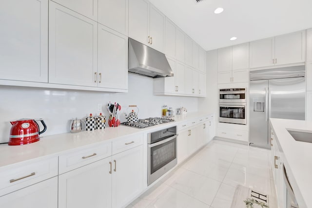 kitchen featuring white cabinetry and stainless steel appliances