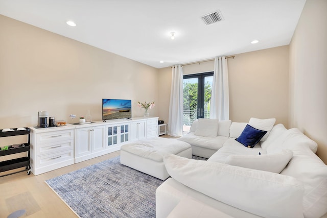 living room with light hardwood / wood-style floors