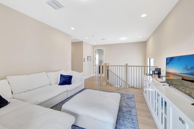 living room with light hardwood / wood-style flooring