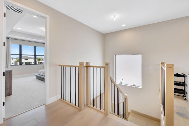 hallway with light hardwood / wood-style flooring