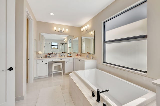 bathroom featuring vanity, shower with separate bathtub, and tile patterned flooring